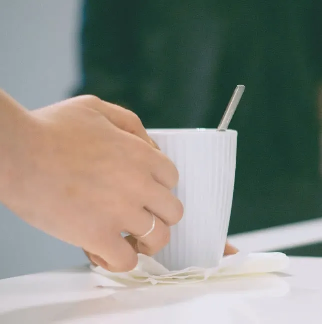 Hand holding a cup of tea